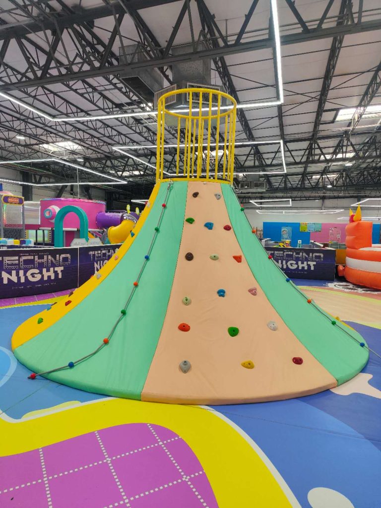 Climbing cone in a trampoline adventure park